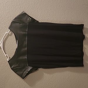 Women's black t-shirt with leather top.